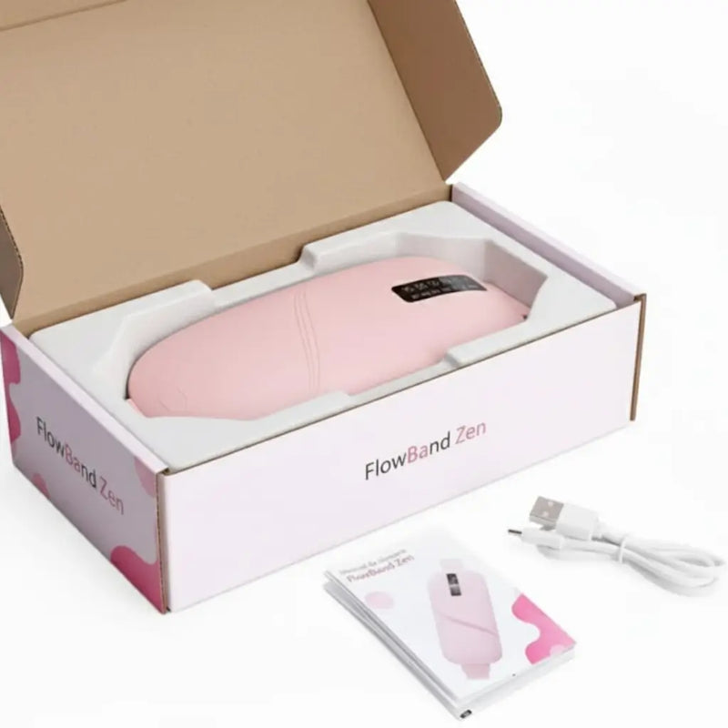 Imagen de FlowBand Zen junto a su cable USB y manual, mostrando el kit completo del masajeador térmico portátil.